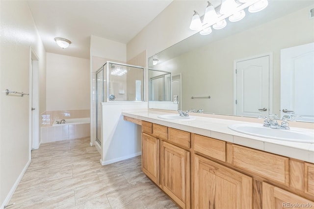 bathroom with double vanity, a sink, a garden tub, and a stall shower