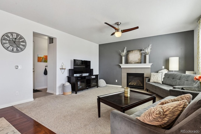 living room featuring ceiling fan and carpet flooring