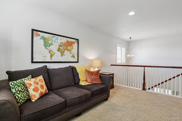 living room with carpet floors and a chandelier