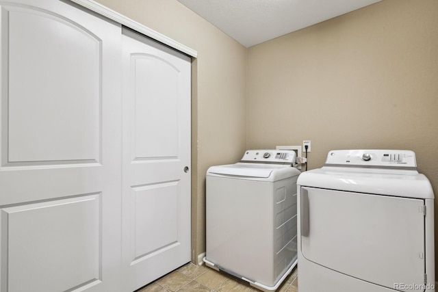 laundry room featuring independent washer and dryer