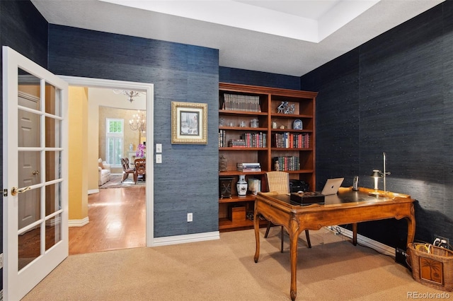 office area featuring hardwood / wood-style floors and a chandelier