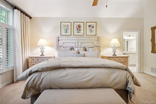 carpeted bedroom featuring ensuite bathroom and ceiling fan