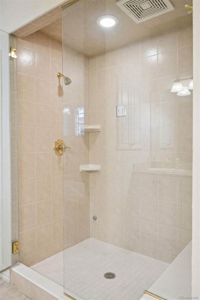 bathroom with an enclosed shower