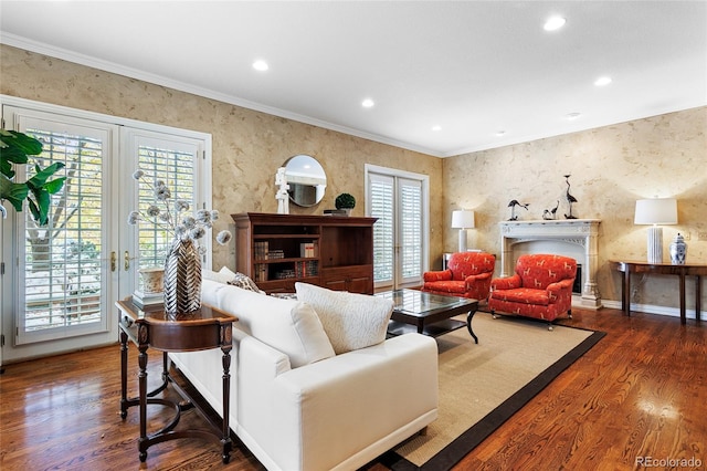 living room with dark hardwood / wood-style floors and ornamental molding