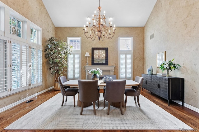 dining room featuring a chandelier, hardwood / wood-style flooring, and plenty of natural light