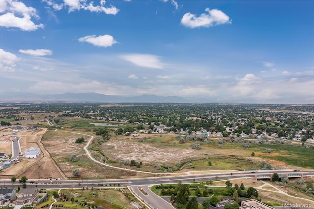 birds eye view of property with a mountain view