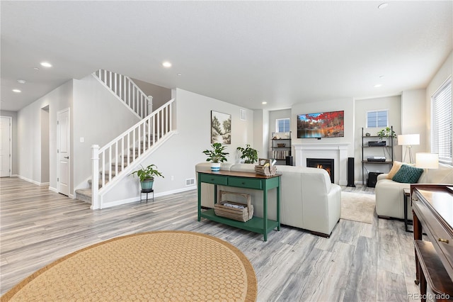 living room with light hardwood / wood-style flooring