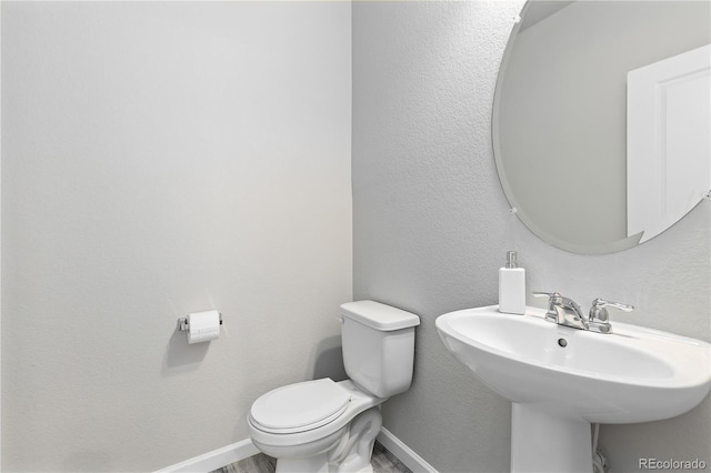 bathroom with toilet and sink