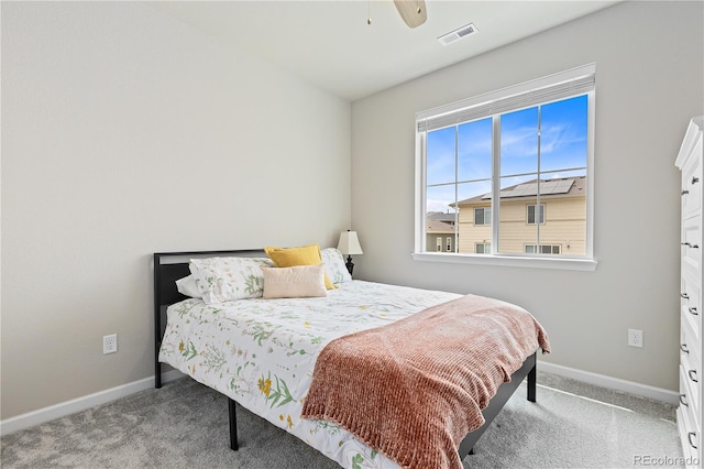 bedroom with ceiling fan and light colored carpet