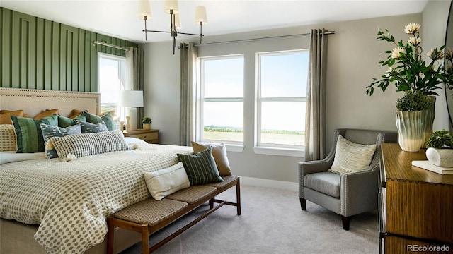 bedroom with carpet and a chandelier