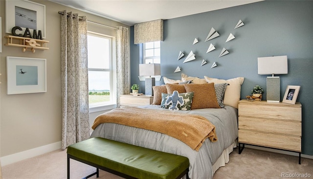 carpeted bedroom featuring multiple windows