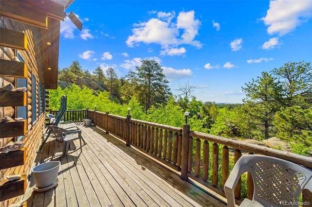 3980 County Rd 71, Guffey, CO 80820 - wooden deck featuring a forest view