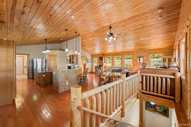 3980 County Rd 71, Guffey, CO 80820 - staircase with lofted ceiling, wooden ceiling, ceiling fan, and hardwood / wood-style flooring