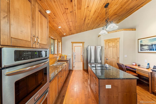 3980 County Rd 71, Guffey, CO 80820 - kitchen with appliances with stainless steel finishes, lofted ceiling, light wood finished floors, brown cabinets, and wood ceiling