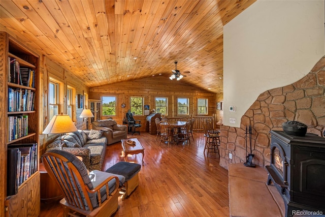 3980 County Rd 71, Guffey, CO 80820 - living room with wooden ceiling, hardwood / wood-style flooring, lofted ceiling, a ceiling fan, and a wood stove