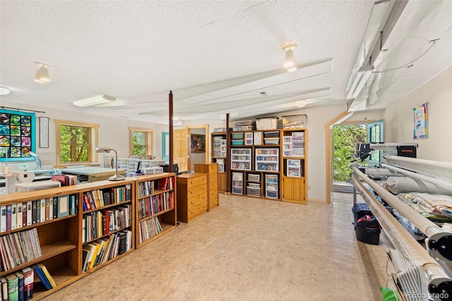 3980 County Rd 71, Guffey, CO 80820 - home office featuring healthy amount of natural light, a textured ceiling, and tile patterned floors