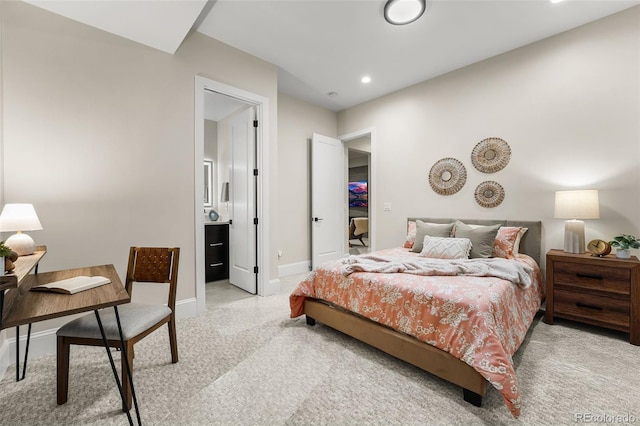 carpeted bedroom with ensuite bathroom