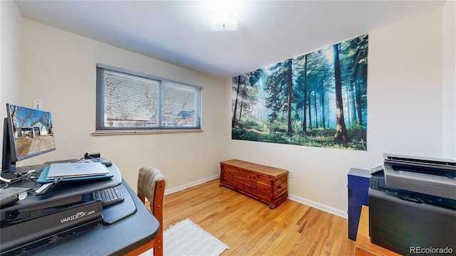 office space featuring light wood finished floors and baseboards