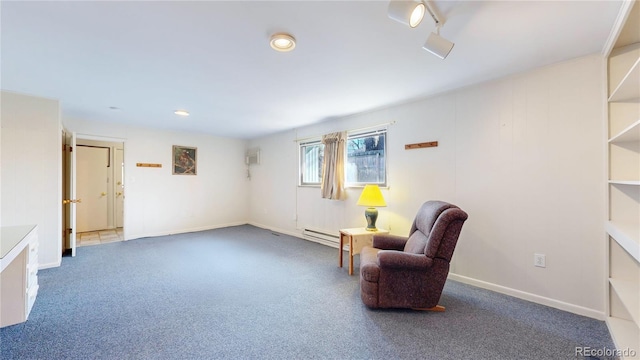 living area featuring baseboards and carpet flooring