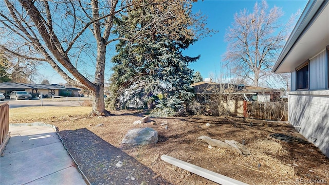 view of yard featuring fence