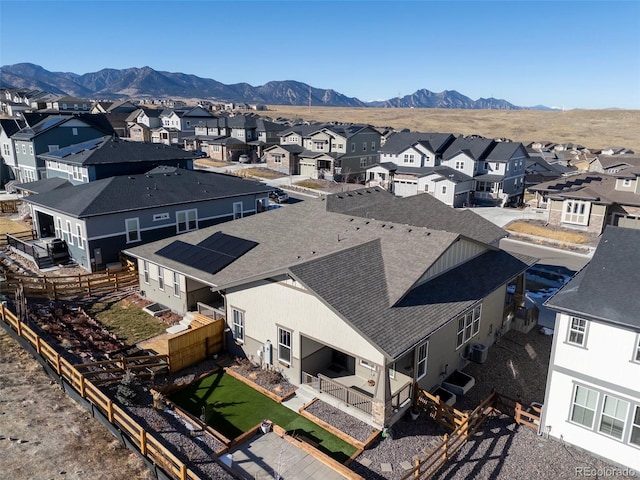 birds eye view of property featuring a mountain view