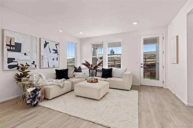 17412 W 93rd Pl, Arvada, CO 80007 - living room featuring wood finished floors, healthy amount of natural light, and recessed lighting