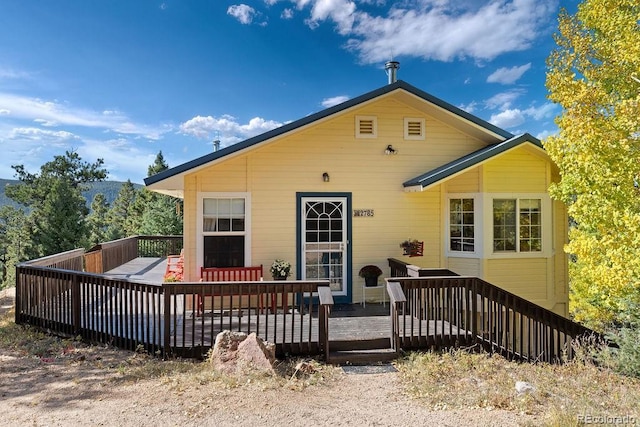 view of front of home featuring a wooden deck