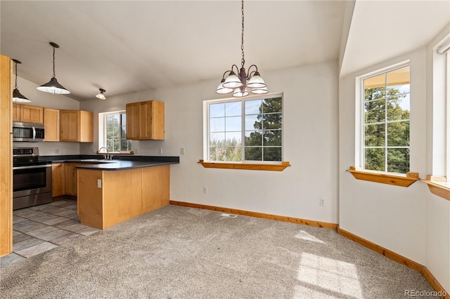 kitchen featuring appliances with stainless steel finishes, a sink, light colored carpet, baseboards, and vaulted ceiling