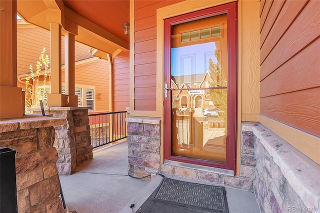 view of exterior entry featuring a porch