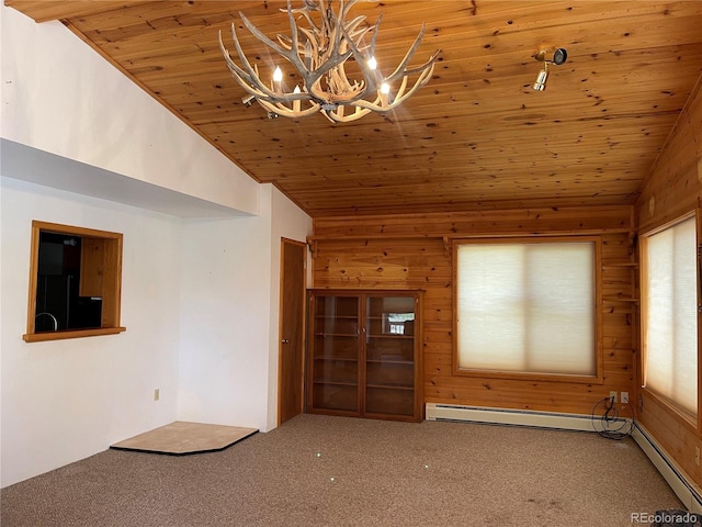 60 Pawnee Path, Lake George, CO 80827 - empty room featuring lofted ceiling, a chandelier, carpet flooring, wooden walls, and wood ceiling