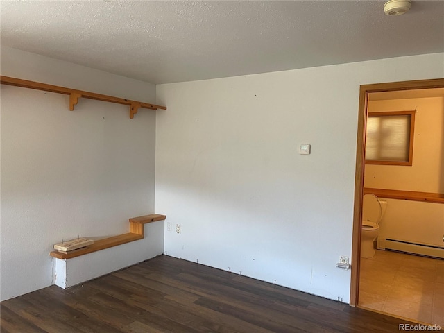 60 Pawnee Path, Lake George, CO 80827 - spare room featuring a baseboard radiator, wood finished floors, and a smoke detector
