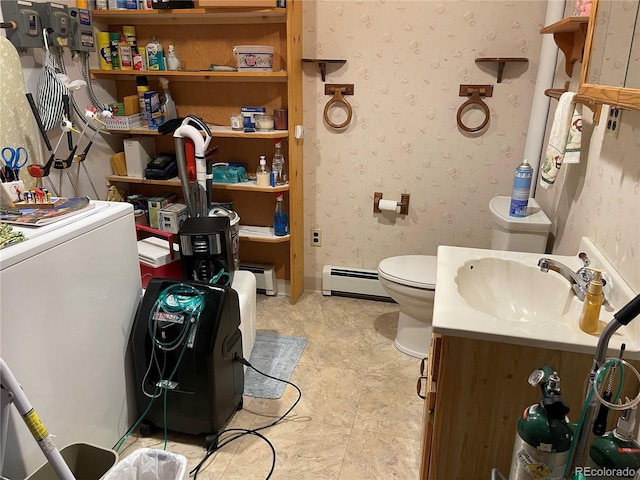 60 Pawnee Path, Lake George, CO 80827 - bathroom with a baseboard heating unit, vanity, and wallpapered walls