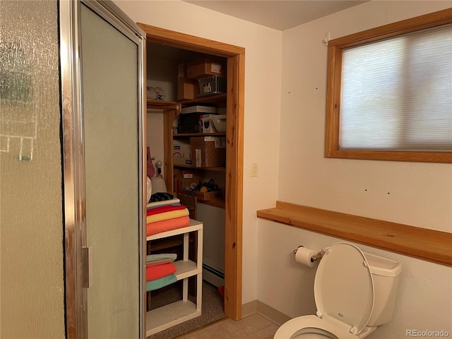 60 Pawnee Path, Lake George, CO 80827 - full bathroom with a baseboard radiator, a shower with door, and tile patterned floors