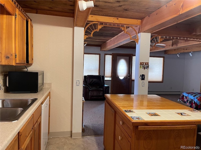 60 Pawnee Path, Lake George, CO 80827 - kitchen with black microwave, baseboard heating, tile countertops, brown cabinetry, and wood ceiling