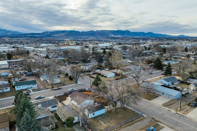 birds eye view of property with a mountain view