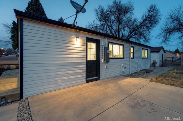 rear view of property featuring a patio area