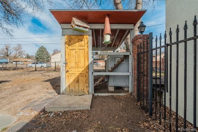 view of outdoor structure featuring fence