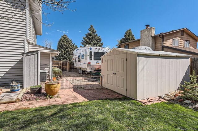 view of shed with fence