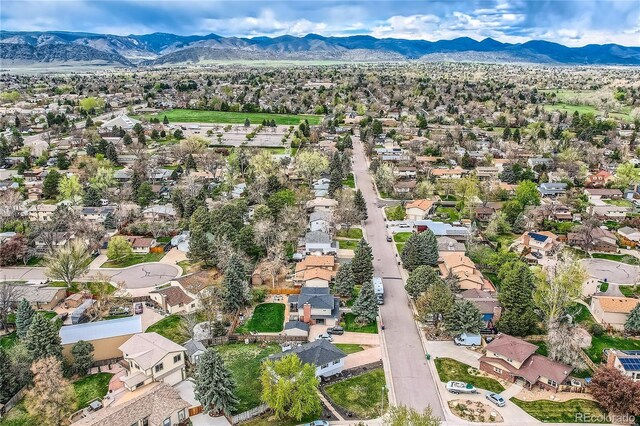 aerial view featuring a mountain view and a residential view