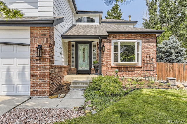 doorway to property with a garage