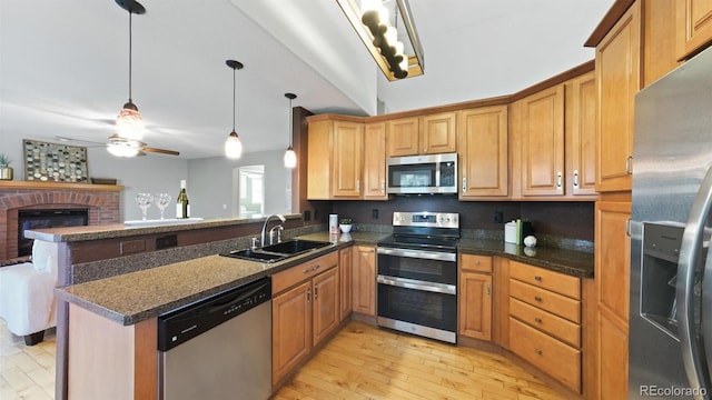 5150 Morning Glory Pl, Highlands Ranch, CO 80130 - kitchen with appliances with stainless steel finishes, a peninsula, ceiling fan, pendant lighting, and open floor plan