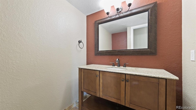 5150 Morning Glory Pl, Highlands Ranch, CO 80130 - bathroom featuring a textured wall and vanity