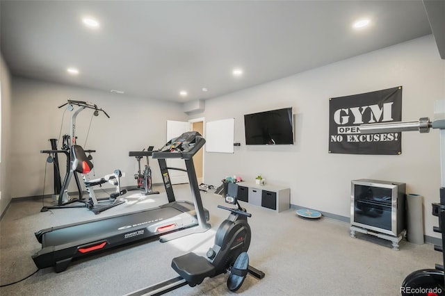 exercise area with baseboards and recessed lighting