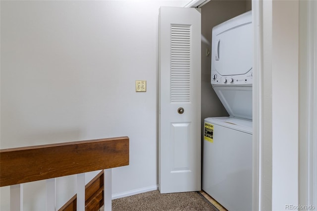 8463 Everett Way Unit B, Arvada, CO 80005 - laundry area featuring stacked washer / dryer and light colored carpet