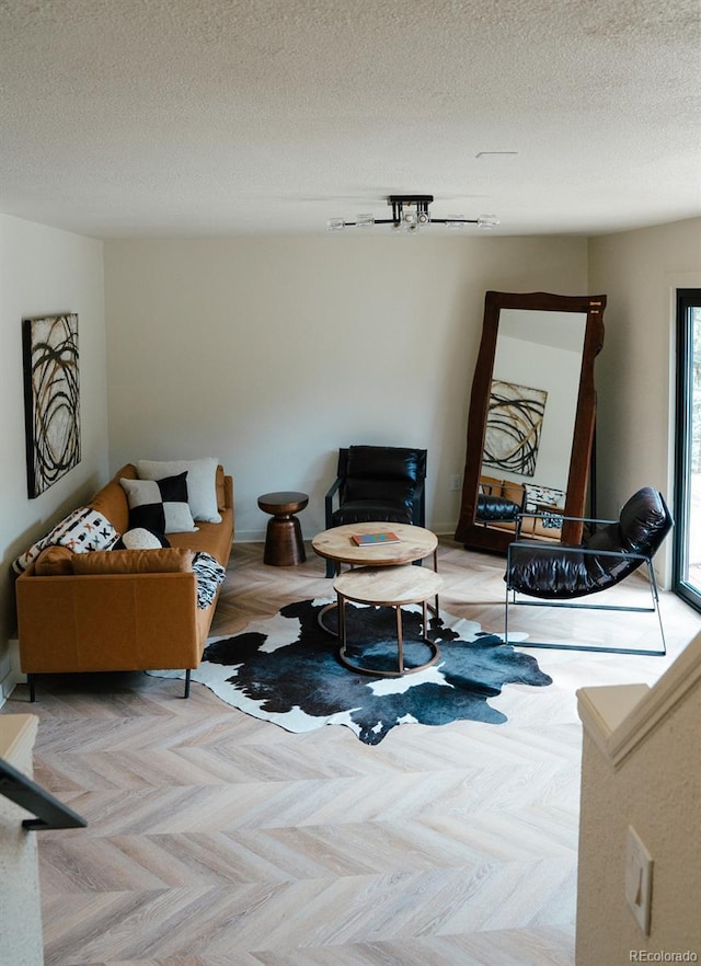 30938 Niakwa Rd, Evergreen, CO 80439 - living area with a textured ceiling and baseboards