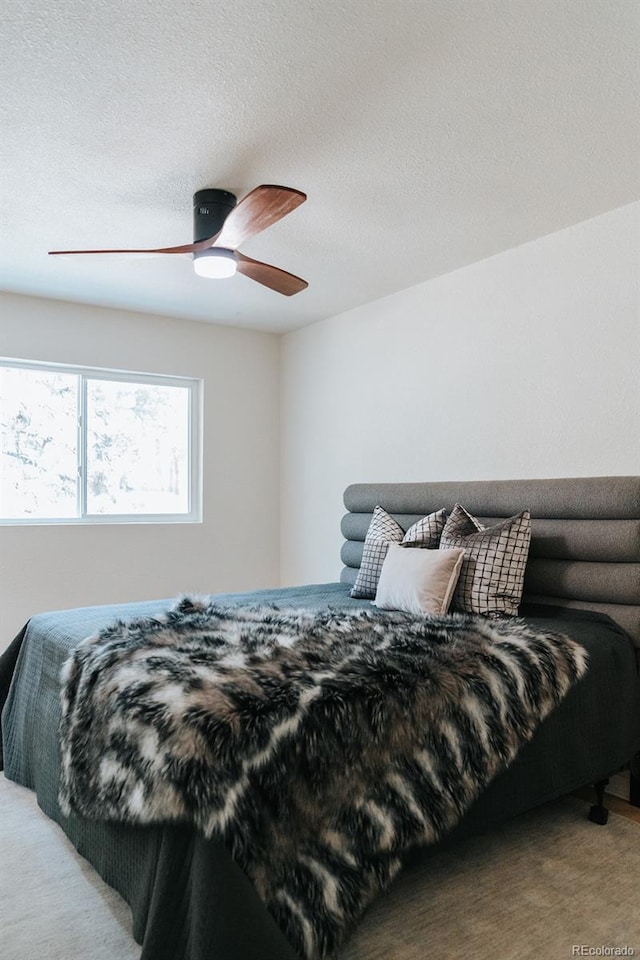 30938 Niakwa Rd, Evergreen, CO 80439 - carpeted bedroom featuring ceiling fan and a textured ceiling