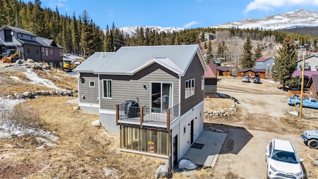 255 Flannigan Cir, Alma, CO 80420 - rear view of house featuring a mountain view and a balcony