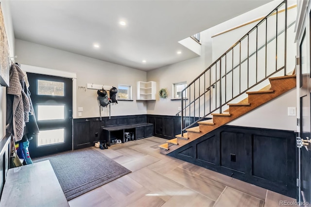 255 Flannigan Cir, Alma, CO 80420 - entryway with recessed lighting, stairway, and a wainscoted wall