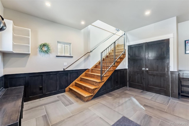 255 Flannigan Cir, Alma, CO 80420 - stairs featuring recessed lighting, a decorative wall, and a wainscoted wall
