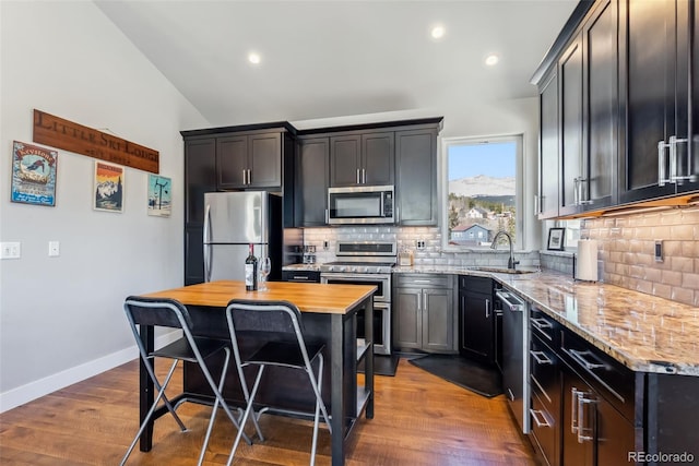 255 Flannigan Cir, Alma, CO 80420 - kitchen with a sink, appliances with stainless steel finishes, tasteful backsplash, and light stone counters